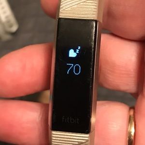 Fitbit Alta HR and various colored bans.   Monitors heart rate and sleep